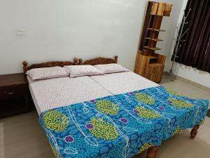 Postel nebo postele na pokoji v ubytování Thekkekara Budget Rooms