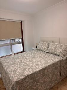 a bedroom with a bed and a window at GaliciaGuestHome Peregrina 18 in Pontevedra