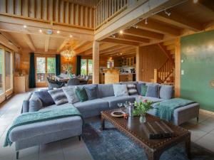 a living room with a couch and a table at Chalet Isla de Lux - OVO Network in La Côte dʼArbroz