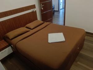Postel nebo postele na pokoji v ubytování Thekkekara Budget Rooms