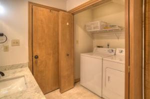 a small laundry room with a washer and dryer at 2 2 Ferringway 33 in Durango +24 photos