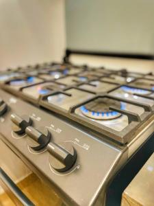 a gas stove top with blue lights on it at Casa Bonita PXM in Puerto Escondido