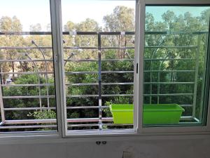 an open window with a view of trees at Meknès Escale in Meknès