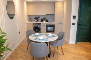 a kitchen with a table and chairs in a room at VIVASTAY Casablanca -Corniche Le claridge Emerauld with gym and rooftop in Casablanca