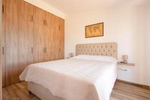 Ένα ή περισσότερα κρεβάτια σε δωμάτιο στο Big Hill Apartment 2