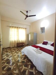 Postel nebo postele na pokoji v ubytování Comfort Suites Apartment