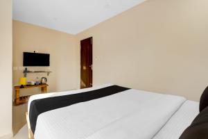 Giường trong phòng chung tại Hotel O M S Boarding and Lodging +23 ảnh