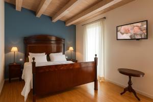 Postel nebo postele na pokoji v ubytování Agriturismo Trerè