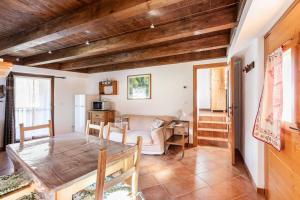 a living room with a table and a couch at Champex Apartments in Pré-Saint-Didier
