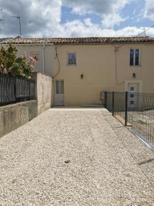 a house with a fence in front of it at Jolie Maison au 34 centre-ville in Angoulême