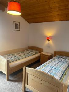 Postel nebo postele na pokoji v ubytování Haus Käfersberg