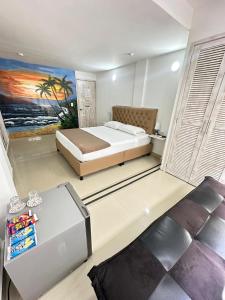 Postel nebo postele na pokoji v ubytování Hotel Hernández CTG