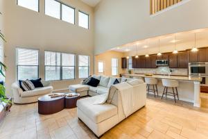 a living room with couches and a kitchen at 7 Mi to Lake Casa Blanca Laredo Family Home! in Laredo
