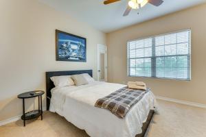 a bedroom with a bed and a ceiling fan at 7 Mi to Lake Casa Blanca Laredo Family Home! in Laredo +31 photos