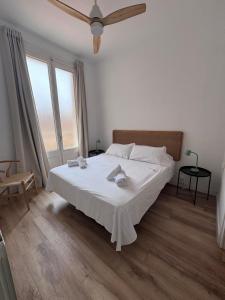 Postel nebo postele na pokoji v ubytování Calma House Rooms