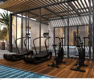 a group of exercise bikes on a wooden deck at مرسال بارك in Riyadh