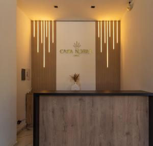 a lobby with a cash node sign on the wall at Casa Noral Hotel in Copacabana +27 photos