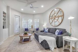 a living room with a couch and a table at Le Reve Chamant- Martinique Villa in Gulf Highlands