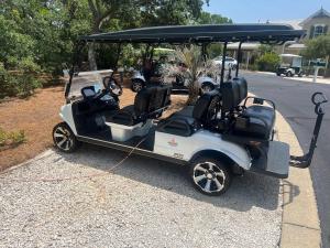 a golf cart parked on the side of the road at Le Reve Chamant- Martinique Villa in Gulf Highlands