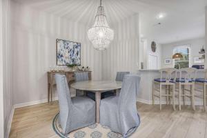 a dining room with a table and chairs at Le Reve Chamant- Martinique Villa in Gulf Highlands +28 photos