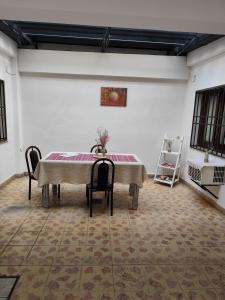 a dining room with a table and chairs at Cerro del sol, habitaciones privadas in Salta