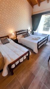 Cama ou camas em um quarto em Hosteria El Condado