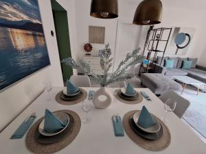 a dining room table with hats on top of it at La Vida appartment 1 in Klagenfurt