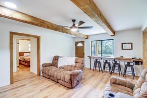 a living room with a couch and a table at 2 Mi to Buffalo River Peaceful Family Retreat 