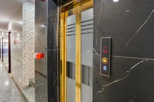 a close up of a yellow door on a building at Super Hotel O Hotel Gold Star in New Delhi
