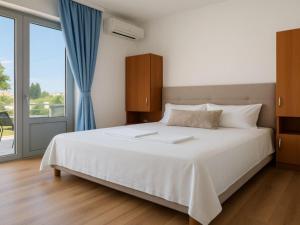 Voodi või voodid majutusasutuse Apartments Hija toas