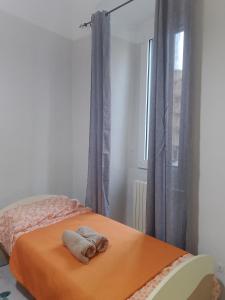 a bedroom with a bed with a towel on it at ARCO in Bisceglie