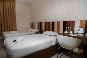 Postel nebo postele na pokoji v ubytování Uptown Subang Airport