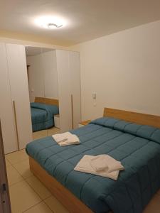 Postel nebo postele na pokoji v ubytování Caraceni Apartaments 1