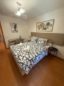Ένα ή περισσότερα κρεβάτια σε δωμάτιο στο 3BR Family-Sized Flat in Lumiar