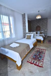 Postel nebo postele na pokoji v ubytování Degirmenli Konak Hotel