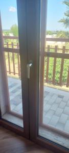 a sliding glass door with a view of a balcony at VALERIA'S HOUSE in Terlizzi