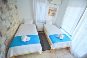 Postel nebo postele na pokoji v ubytování Degirmenli Konak Hotel