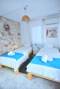 Postel nebo postele na pokoji v ubytování Degirmenli Konak Hotel + 37 fotografií