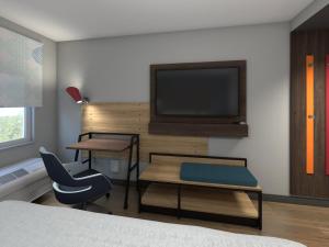 Tru By Hilton Joliet Plainfield的电视和/或娱乐中心