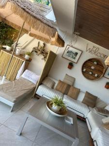 a living room with a couch and a table at LA MAISON DE DOMS vue mer in Cassis