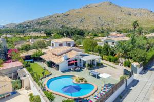 an aerial view of a house with a swimming pool at Villa Maite by Villa Plus in El Port