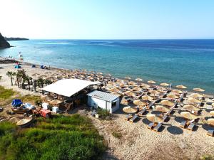 an overhead view of a beach with umbrellas and the ocean at Casa Di Oliva 2 in Vergia