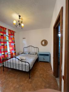a bedroom with a bed and a blue night stand at Vila Seascape in 2 Mai +44 photos
