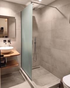 a bathroom with a shower and a sink at Kaia Studios Agnondas in Agnontas +15 photos