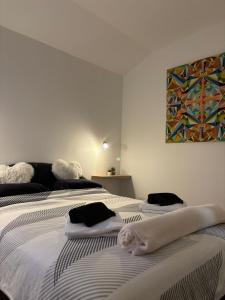 Posteľ alebo postele v izbe v ubytovaní Apartman M - sa dvije spavaće sobe