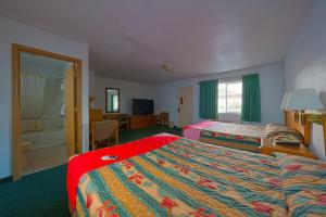 Postel nebo postele na pokoji v ubytování Budget 8 Motel