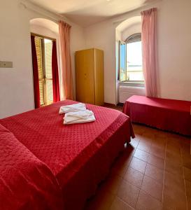 Ένα ή περισσότερα κρεβάτια σε δωμάτιο στο Hotel Timiama