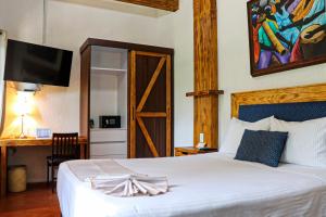 Postel nebo postele na pokoji v ubytování Casa Real Coyoacán
