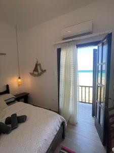 Postel nebo postele na pokoji v ubytování Dovas house
