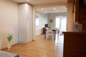 a living room with a kitchen and a dining room at Villa Giove 1 in Terracina